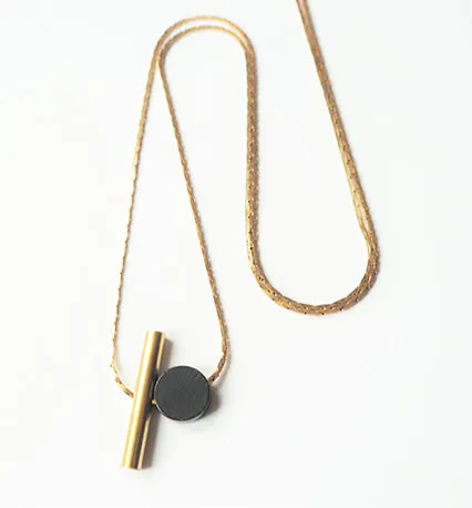 Brass Cylinder & Black Disc Necklace | by brass bold